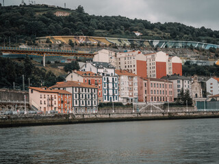 Obraz premium Incredible views of Bilbao. Skyscrapers, river and buildings of the País Vasco (España). Modern, fishing and industrial city of Spain. Spanish lifestyle, modern European city.