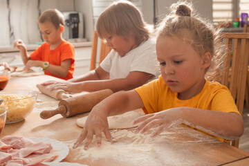 the little boy is preparing his favorite dish