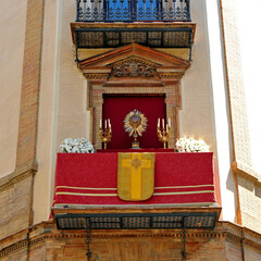 Balcony decorated for the Corpus Christi procession on Avenue of Constitution in the historic center of Seville, Spain 