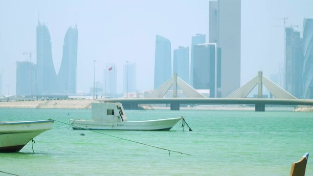 Boats moored in the shallow waters of Muharraq's beach