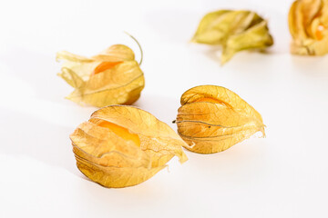bright juicy yellow physalis berries close-up on a white background