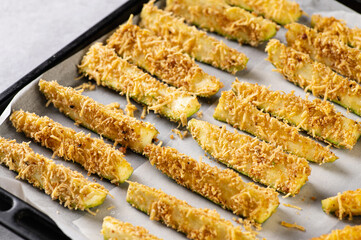 raw sliced zucchini, breaded in breadcrumbs and cheese, ready to bake in the oven, semi-finished product