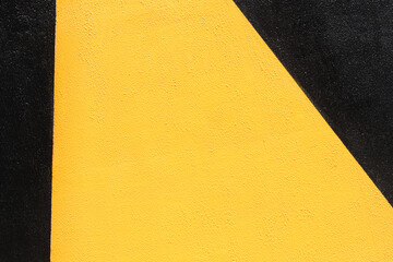 Closeup of duo colored black and yellow urban wall texture. Modern pattern for wallpaper design....