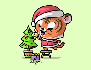 A CUTE TIGER IS DECORATING A CHRISTMAS TREE AND FEELING SO HAPPY.