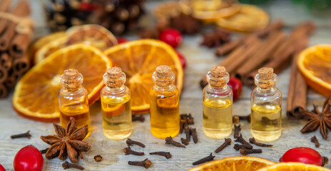 Christmas essential oils in small bottles. Selective focus.