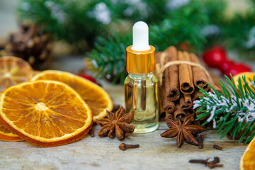 Christmas essential oils in small bottles. Selective focus.