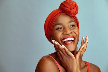 Laughing african american woman wearing red headband