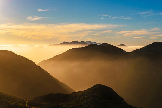 mountain landscape with haze at sunset. Mountain ranges of "Pe&ntilde;a villa" and "cuera" in Llanes, Asturias, Spain.
