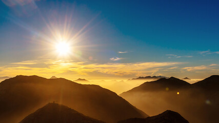 Fototapeta na wymiar mountain landscape with haze at sunset. Mountain ranges of 