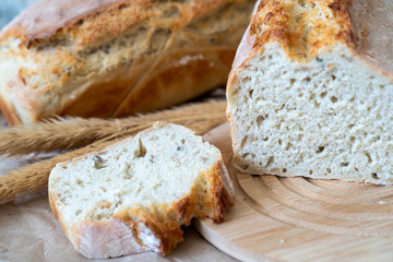 Freshly home baked sliced bread on a wooden board. 