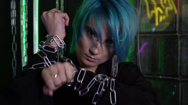 Otaku, a man or woman with his hands tied with a chain. Fan or anime character. Modern youth