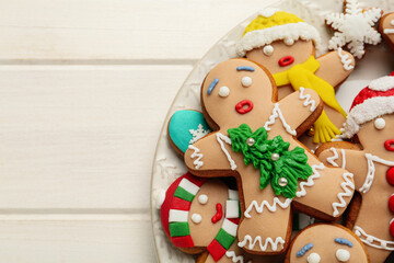 Fototapeta na wymiar Delicious Christmas cookies on white wooden table, top view. Space for text