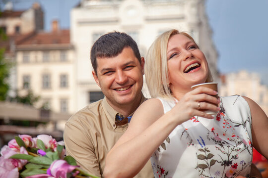 Lovely happy people. Romantic portrait of married couple in love enjoying communication and morning coffee. Horizontal image.