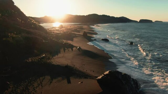 Aerial: Sunrise over Goat Rock Beach at Jenner on the Mendocino Coastline. California, USA
