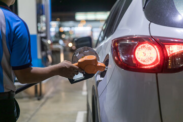 Hand Man Refill and filling Oil Gas Fuel at station. Gas station - refueling. To fill the machine...