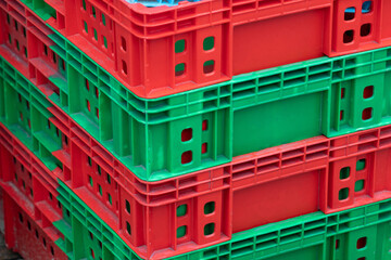 red and green stacked plastic crate.