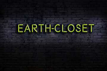 Neon sign. Word earth-closet against brick wall. Night view - obrazy, fototapety, plakaty
