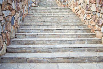 wide staircase in the park, lined with finishing stone. Stone stairs up