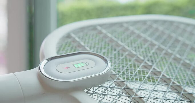 close up battery level light on Electric mosquito killer swatter