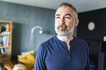 nice Joyful mature man at home appartement with grey beard