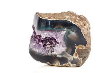 Macro Mineral Stone Amethysts in the rock on a white background