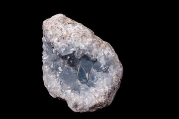 Celestine mineral stone macro on microcline on black background