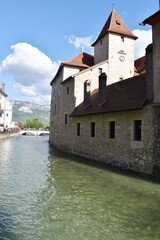 Side view of the island castle in the center of the Thiou canal in Annecy, France