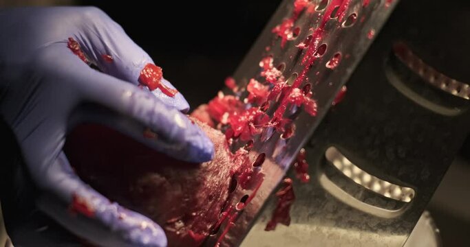 Female hand rubbing beets. Home cooking. 4K