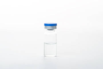 Syringes and glass bottles in white background