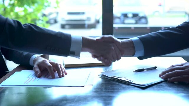 Two Businessman signing contract document start business agreement dealing teamwork