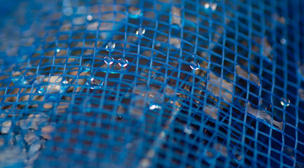 background  water droplets on the blue net - Powered by Adobe