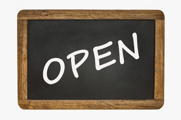 Open, written on a black chalk board with a wooden frame