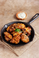Ayam goreng Korea or Yangnyeom chicken is a fried chicken with Korean sauce with sesame seed
