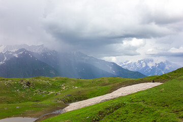 The rain wall moves over the mountains. Mountain landscape. Svaneti, Georgia.