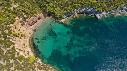 Aerial drone photo of tropical exotic paradise bay with deep turquoise sea and caves forming a blue lagoon visited by luxury yachts and sail boats