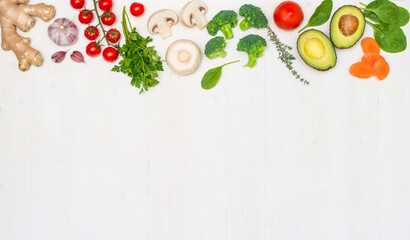 Healthy food ingredients on white wooden background with copy-space.