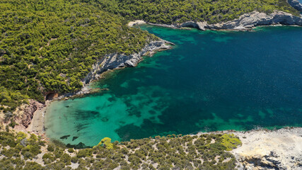 Fototapeta premium Aerial drone photo of famous small bay of Agalipa with crystal clear emerald sea featuring iconic wooden shipwreck left ashore, Skiros island, Sporades, Greece