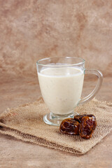 Susu Kurma or Dates Milk in a glass with Dates.