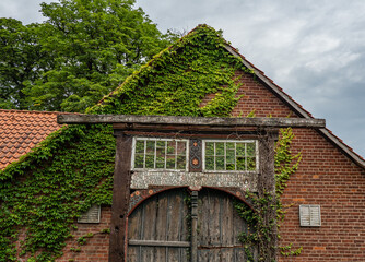 Fototapeta na wymiar old vintage wooden door aganst brick house