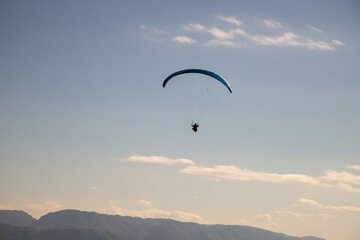 glider paragliding g against blue sky flying  adrenaline and freedom concept