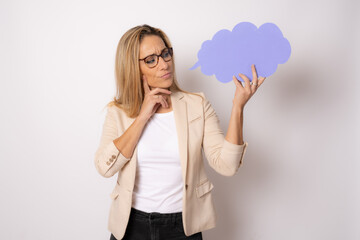 Photo of young attractive woman hold mind paper cloud dreamy curious think finger touch chin isolated over white background