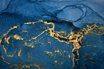 Luxury abstract background in alcohol ink technique, indigo blue gold liquid painting, scattered...