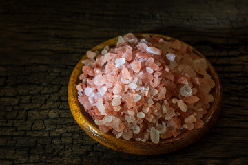 Pink Himalayas salt isolated pile on wood