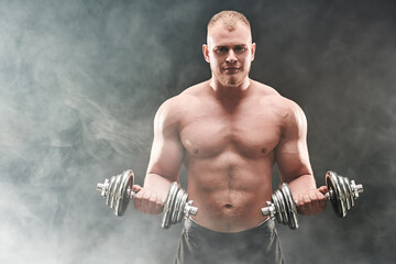 man with dumbbells
