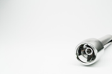 silver flashlight with isolated empty background