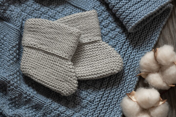 Fototapeta na wymiar little cute socks knitted by hand, cotton, newborn baby concept