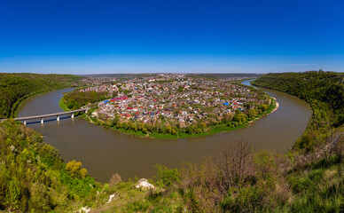 Beautiful view of the canyon with the river Dniester and the city in summer. Zalischyky