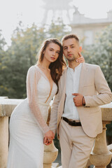 Couple in love. Woman in white dress and man in shirt. 