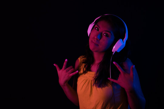 Happy girl listening to music with headphones