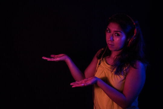 Girl listening to songs with headphones from s and phone